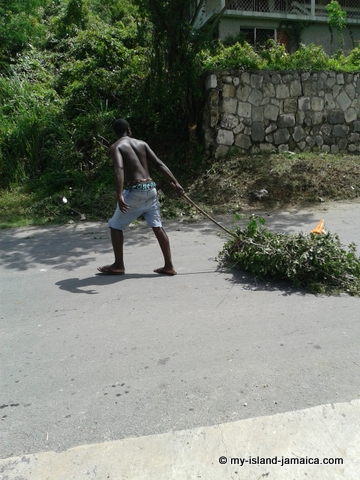 Jamaican Youth Moving Debri