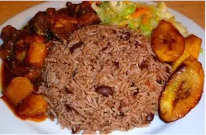 There is virtually only one way to spell Sunday dinner in Jamaica and that is rice and peas (Jamaican red beans and rice) and fried chicken
