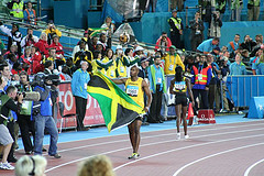 Asafa Powell of Jamaica with Flag