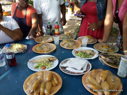 jamaican cuisine  - family eating at little ochie restaurant