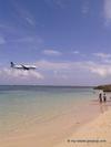 Plane Passing Overhead At Dead End Beach
