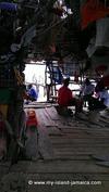 Boat drivers playing dominos at Pelican Bar while tourist play