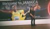 Lolita, at the Airport, posing next to Usain Bolt's poster