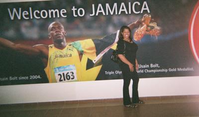 Lolita, at the Airport, posing next to Usain Bolt's poster