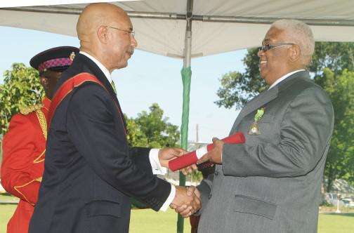 Volier Johnson Receiving The Order Of Distinction From Sir Patrick Allen In October 2013 | (Photo Credit: Jamaica Observer Files)