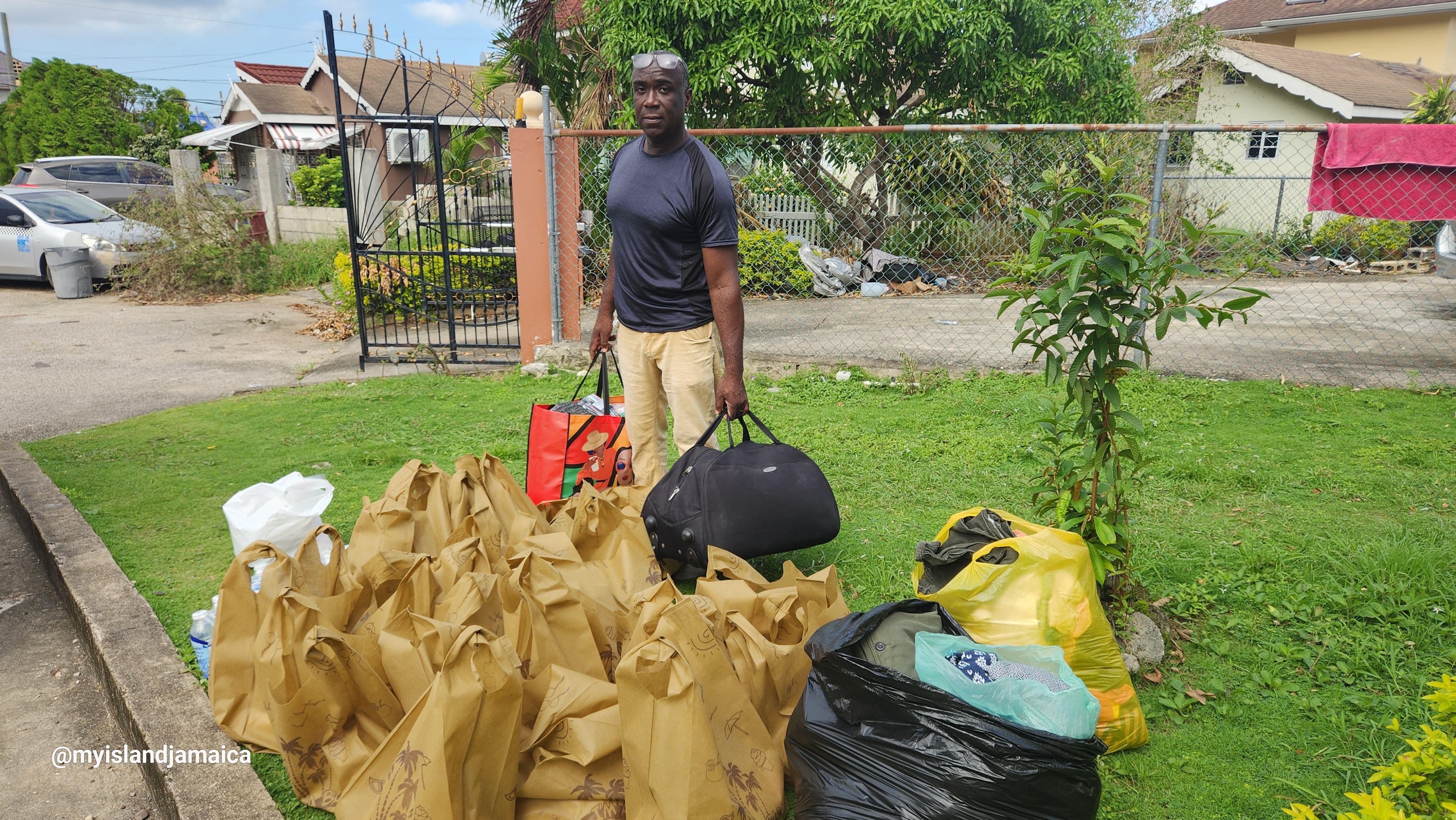 wellesley_gayle_handing_stuff_myislandjamaicafoundation