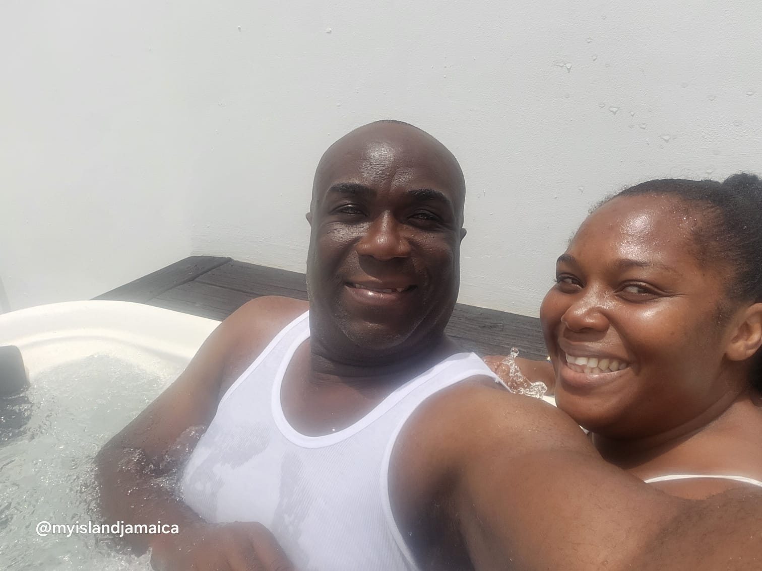 Couple enjoying rooftop Jacuzzi at Ocean Coral Spring Jamaica