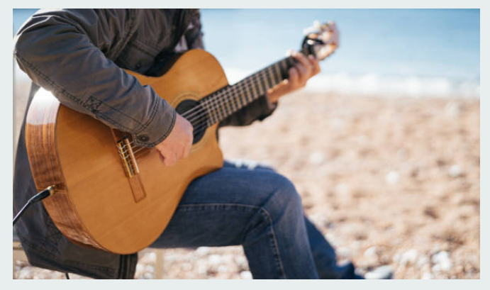 playing guitar on beach jamaica